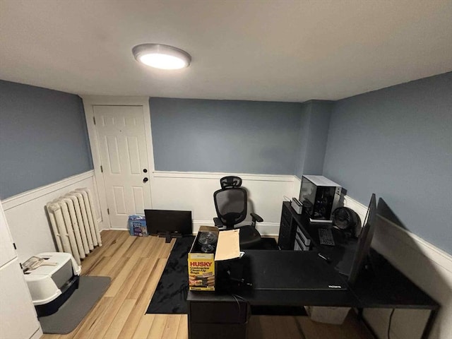 44 Cherry St Unit 2, Swampscott, MA 01907 - office area with light wood-type flooring, wainscoting, and radiator