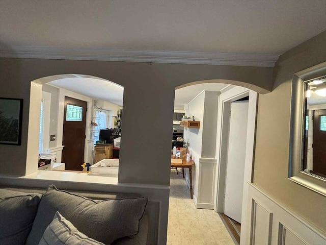 44 Cherry St Unit 2, Swampscott, MA 01907 - living area with arched walkways, ornamental molding, and light wood-type flooring
