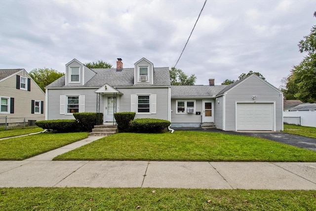 cape cod-style house featuring an attached garage, asphalt driveway, a chimney, and a shingled roof