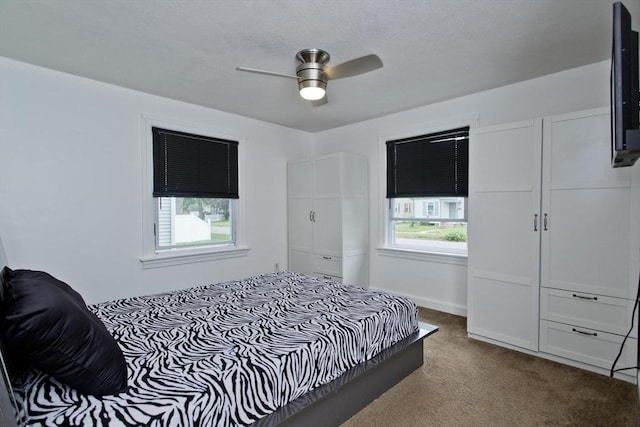 bedroom featuring carpet floors and a ceiling fan
