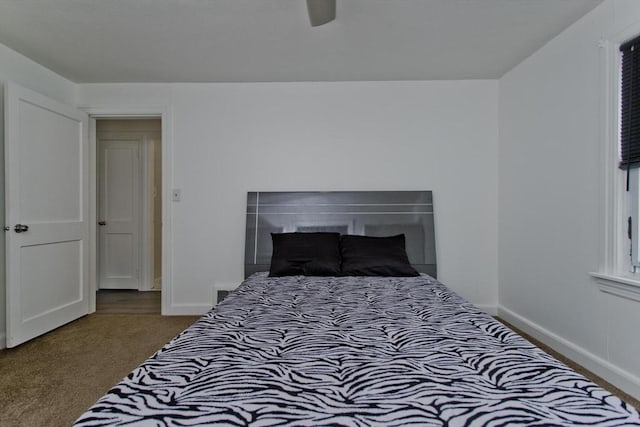 bedroom with carpet, baseboards, and ceiling fan