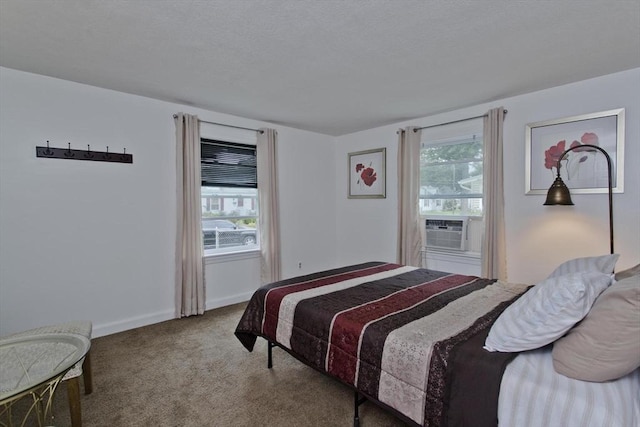 bedroom with carpet floors, cooling unit, and baseboards