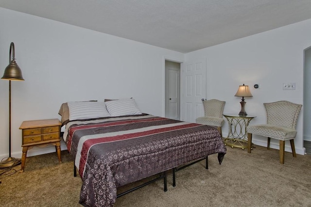 carpeted bedroom with baseboards