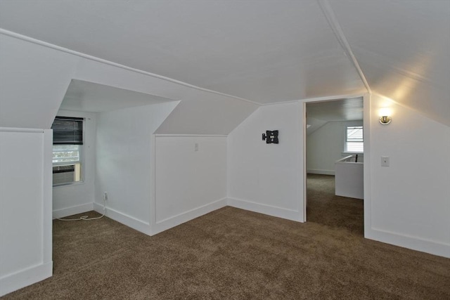 bonus room featuring carpet floors, lofted ceiling, and baseboards