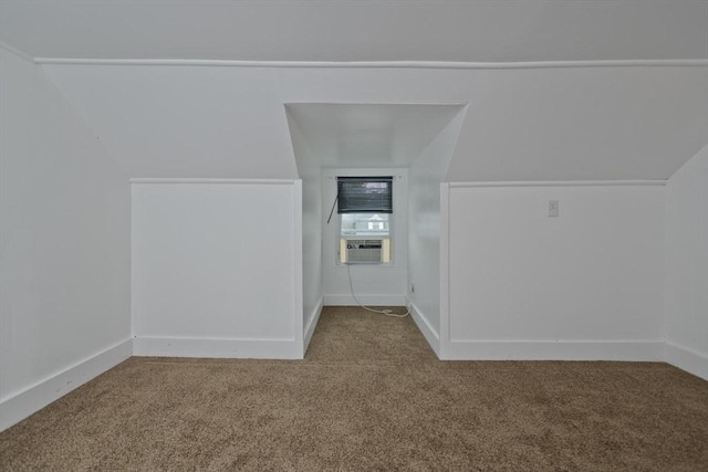 bonus room with carpet floors, cooling unit, and baseboards