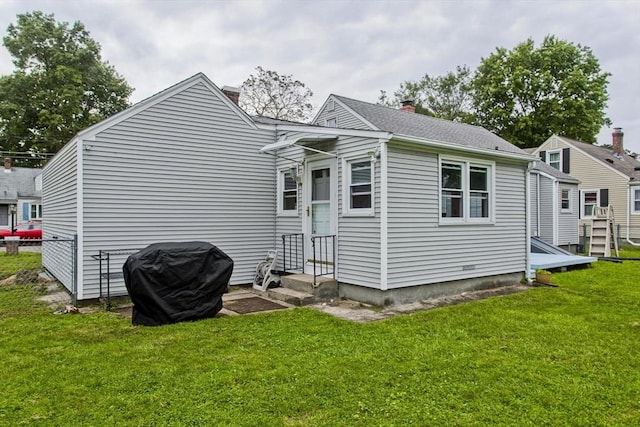 rear view of property with a chimney
