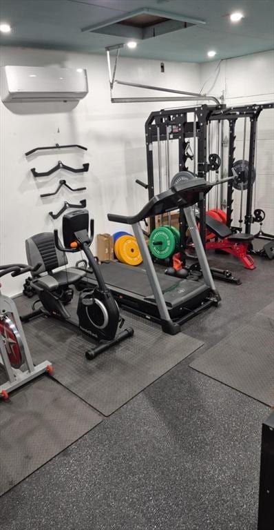 gym with a wall mounted air conditioner