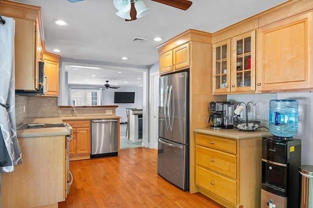 21 Molloy Rd, Georgetown, MA 01833 - kitchen with appliances with stainless steel finishes, ceiling fan, light countertops, decorative backsplash, and recessed lighting