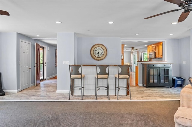 21 Molloy Rd, Georgetown, MA 01833 - kitchen with a ceiling fan, stainless steel microwave, recessed lighting, baseboards, and light carpet
