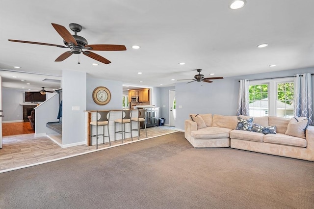 21 Molloy Rd, Georgetown, MA 01833 - living area featuring recessed lighting, a ceiling fan, light colored carpet, baseboards, and stairs