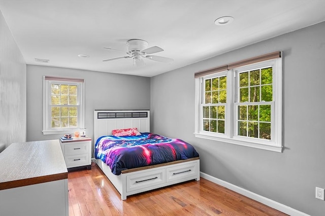 21 Molloy Rd, Georgetown, MA 01833 - bedroom with multiple windows, light wood-type flooring, and baseboards