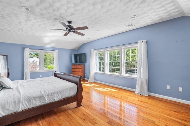 21 Molloy Rd, Georgetown, MA 01833 - bedroom featuring vaulted ceiling, multiple windows, wood finished floors, baseboards, and ceiling fan