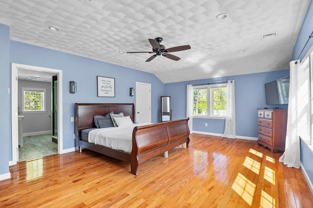 21 Molloy Rd, Georgetown, MA 01833 - bedroom with light wood-style floors, baseboards, multiple windows, and lofted ceiling