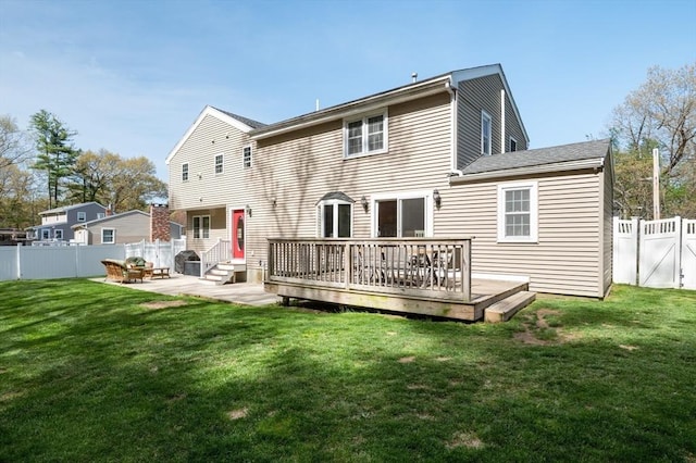 21 Molloy Rd, Georgetown, MA 01833 - back of property featuring a wooden deck, a patio, and a gate