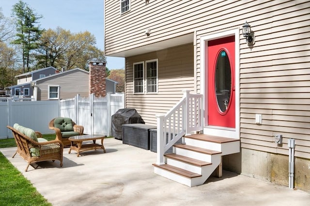 21 Molloy Rd, Georgetown, MA 01833 - property entrance featuring fence, a patio area, and an outdoor living space