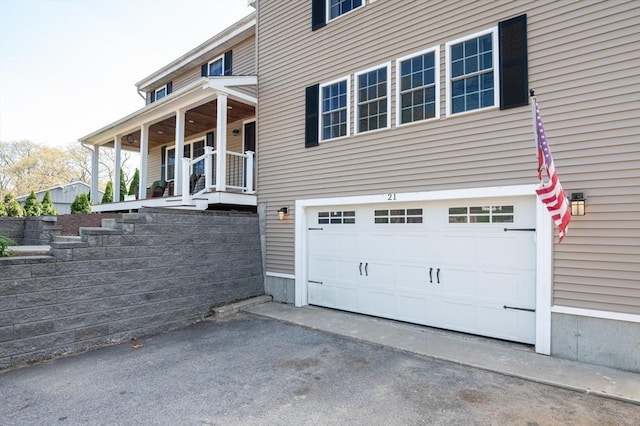 21 Molloy Rd, Georgetown, MA 01833 - view of property exterior featuring an attached garage and driveway