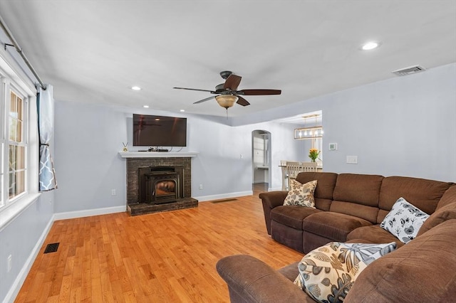 21 Molloy Rd, Georgetown, MA 01833 - living area featuring arched walkways, light wood-type flooring, ceiling fan, baseboards, and recessed lighting