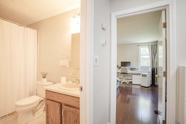 40 Sharron Dr Unit 40, Easton, MA 02375 - full bathroom featuring vanity, baseboard heating, a shower with curtain, and wood finished floors