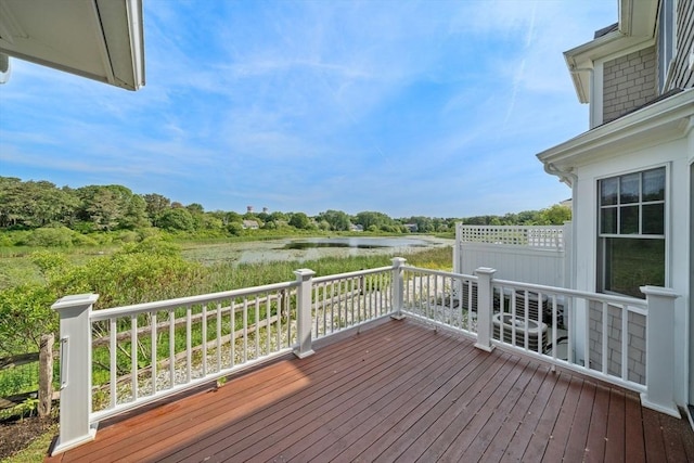 wooden deck with a water view