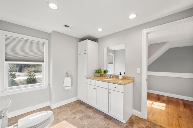 bathroom featuring recessed lighting, visible vents, toilet, vanity, and baseboards