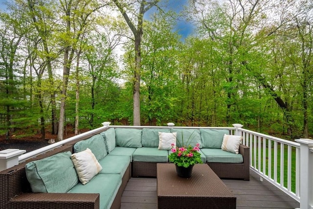 wooden deck with an outdoor living space