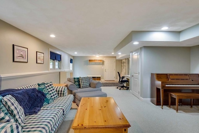 carpeted living area with recessed lighting and baseboards