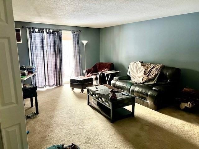 carpeted living room featuring a textured ceiling