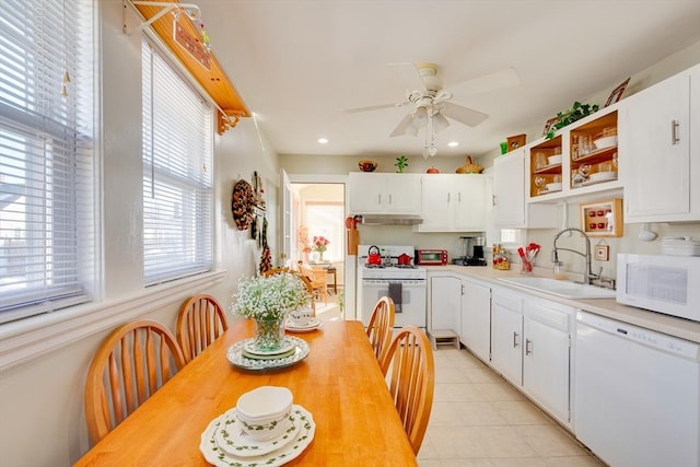 kitchen with white cabinetry, white appliances, ceiling fan, and sink