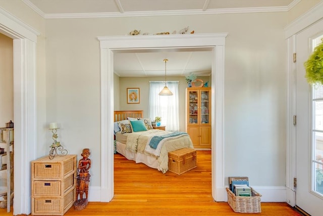 bedroom featuring hardwood / wood-style flooring and ornamental molding