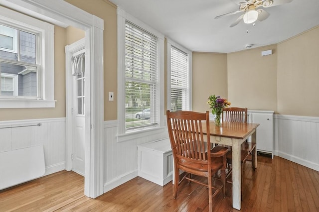 30 Wentworth Ave, Lowell, MA 01852 - dining area with wainscoting, light wood finished floors, and ceiling fan