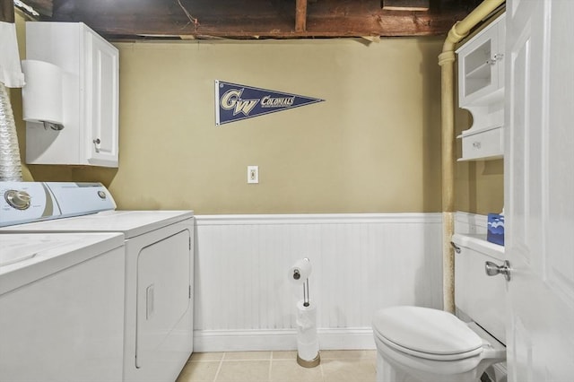 30 Wentworth Ave, Lowell, MA 01852 - laundry area featuring washing machine and dryer, wainscoting, and light tile patterned floors