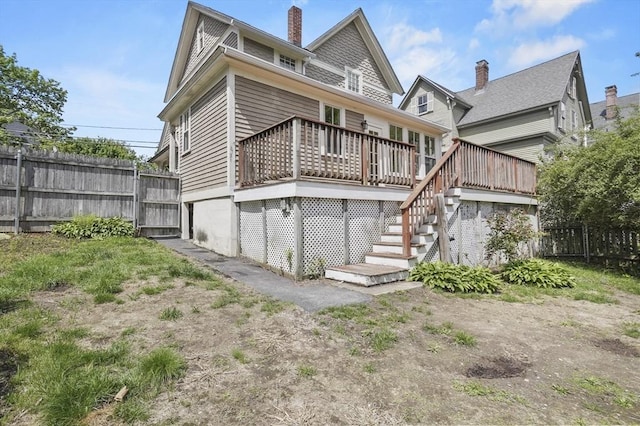30 Wentworth Ave, Lowell, MA 01852 - back of house featuring stairs, fence, and a wooden deck