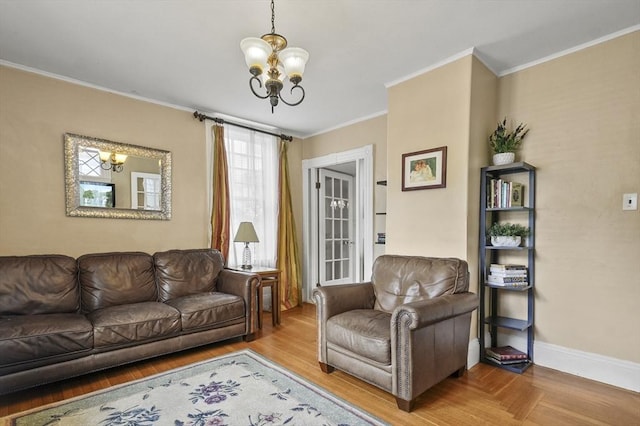 30 Wentworth Ave, Lowell, MA 01852 - living area featuring a chandelier, crown molding, baseboards, and wood finished floors