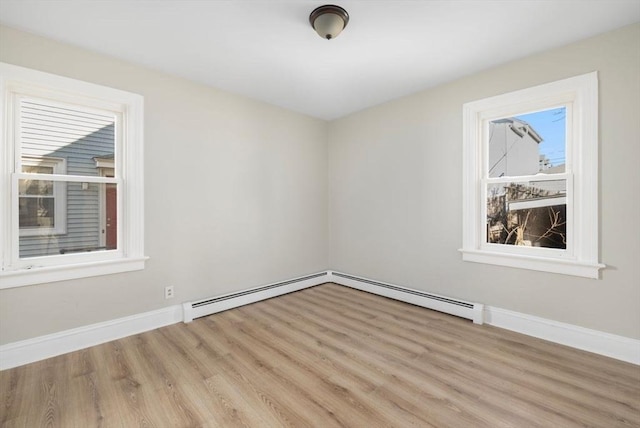 unfurnished room featuring wood finished floors and baseboards