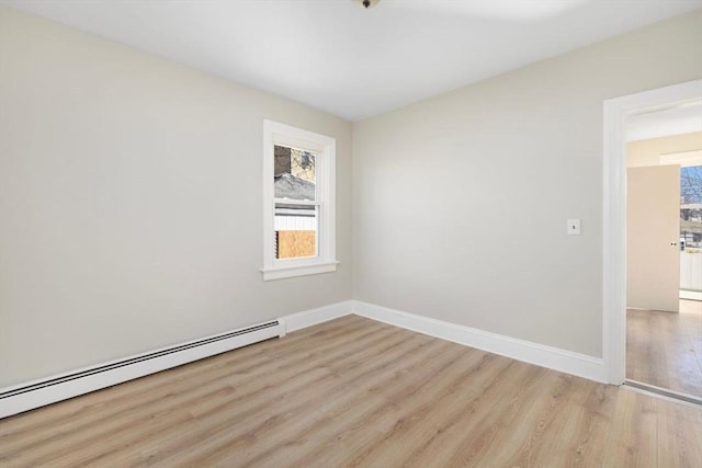 unfurnished room with light wood-type flooring, baseboards, and baseboard heating