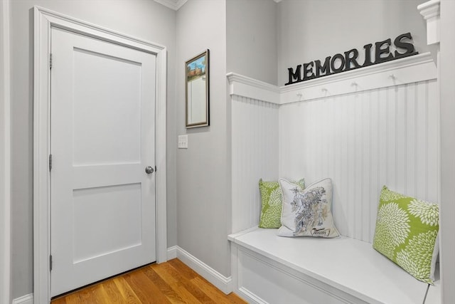 mudroom featuring light wood-type flooring and baseboards