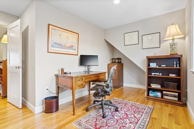 office area featuring wood finished floors and baseboards