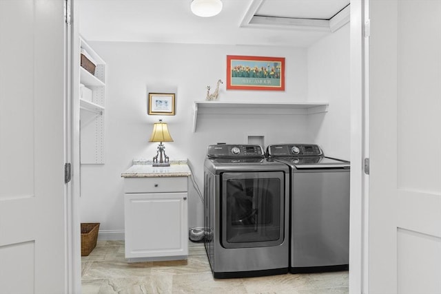 laundry room featuring cabinet space and washer and dryer