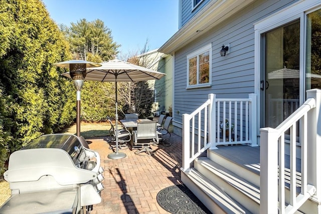 view of patio / terrace featuring a grill and outdoor dining space