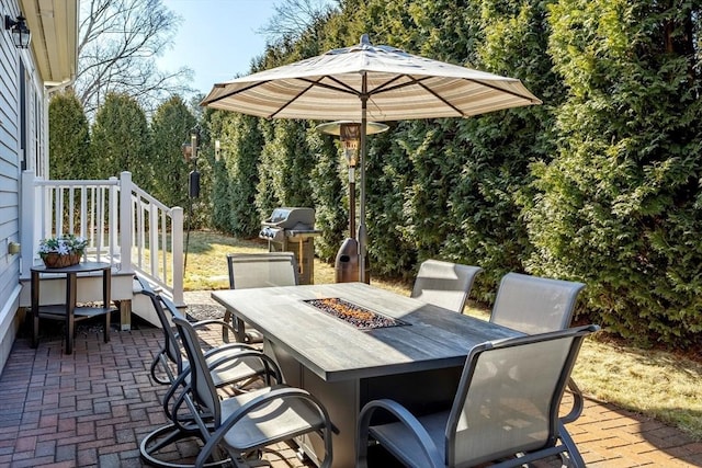 view of patio / terrace with outdoor dining space and grilling area