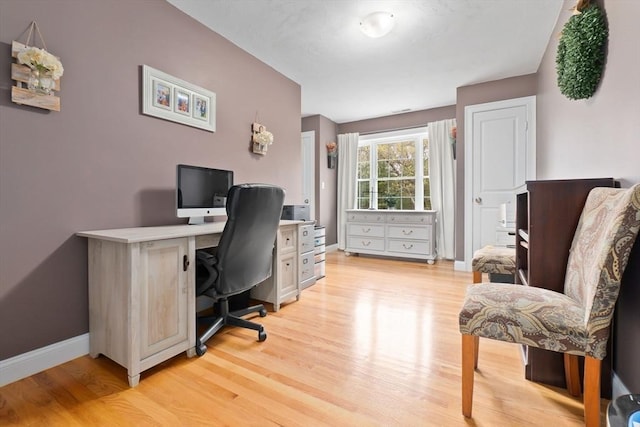 office space featuring light wood finished floors and baseboards