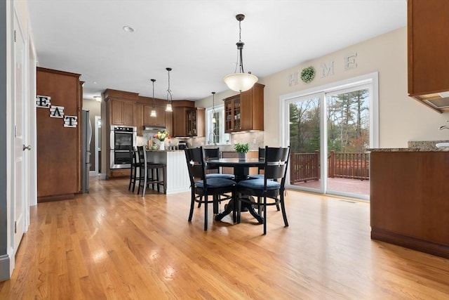 dining space with light wood-style floors
