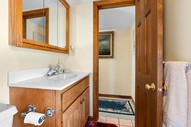 bathroom with tile patterned flooring and vanity