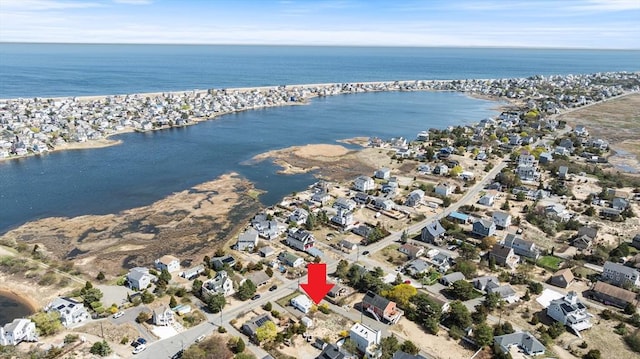 bird's eye view featuring a water view and a residential view