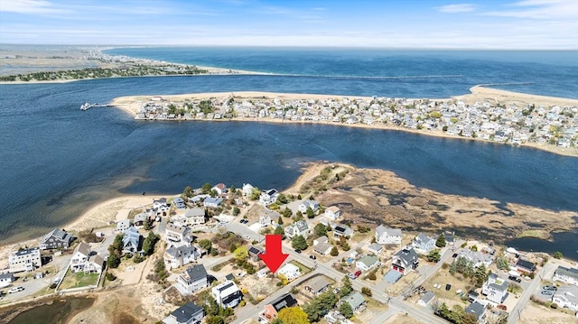 birds eye view of property featuring a water view and a residential view