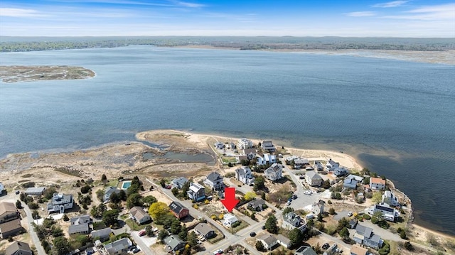 drone / aerial view with a water view and a residential view