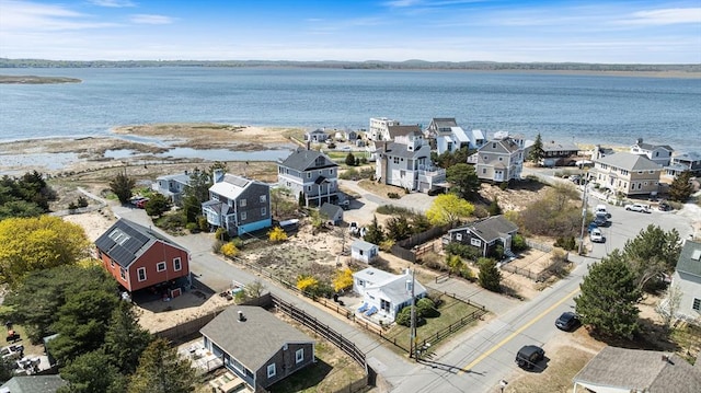 drone / aerial view featuring a water view and a residential view