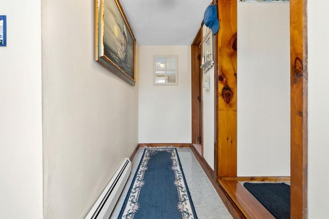 hall featuring baseboards and a baseboard radiator