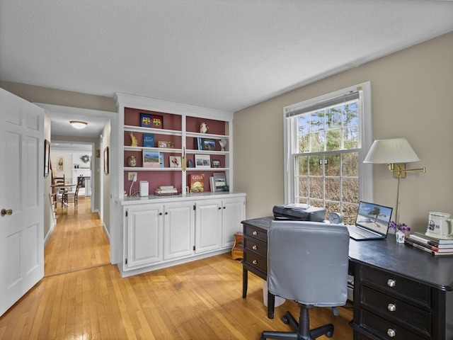 office area with light wood-type flooring