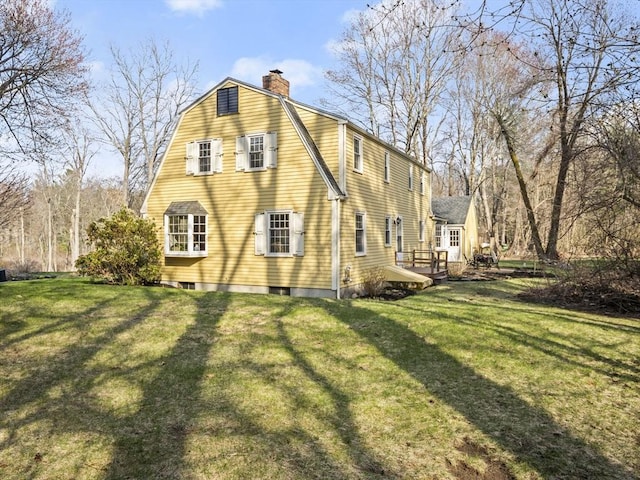 view of home's exterior with a lawn and a chimney
